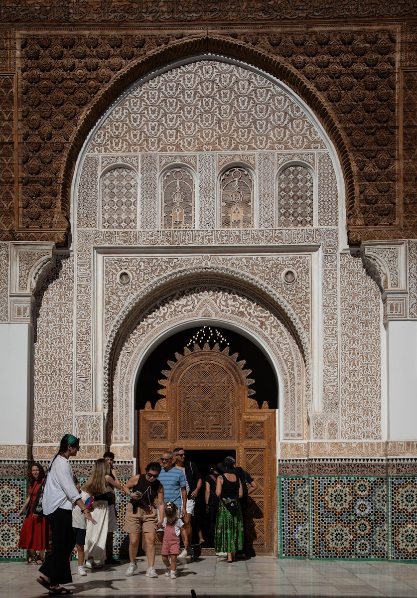 Senior travelers enjoying a guided tour in Marrakech medina, Morocco