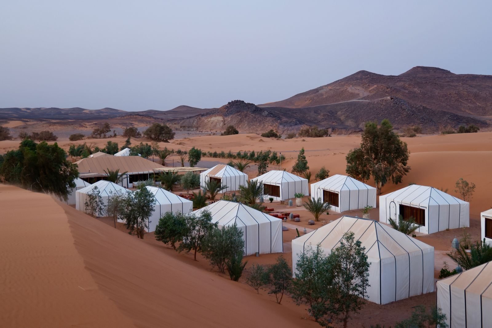 Aerial view of luxury tents in desert Morocco Holidays From Birmingham | Private Tours & Packages